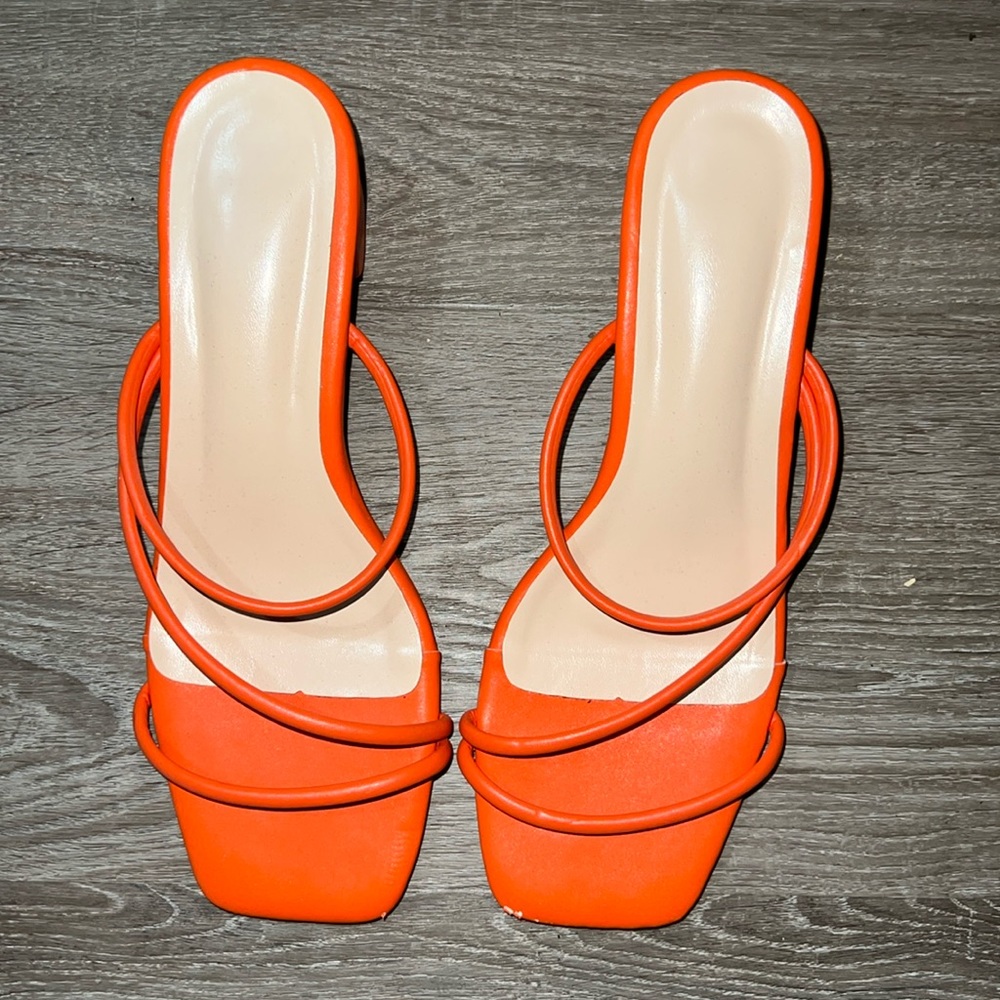Orange, open toed kitten heels